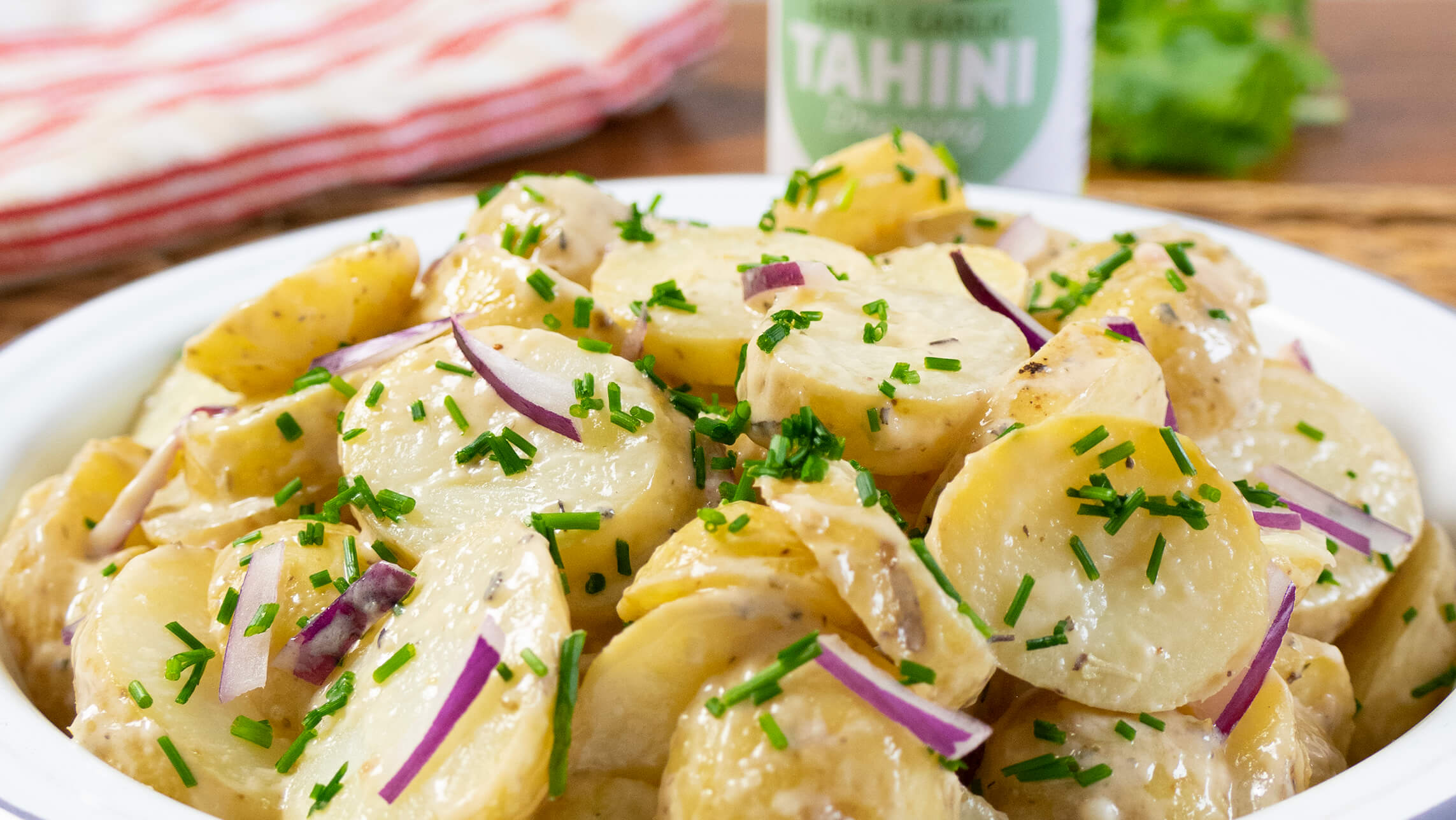 Nutritious vegan potato salad with our Garlic & Herb Dressing