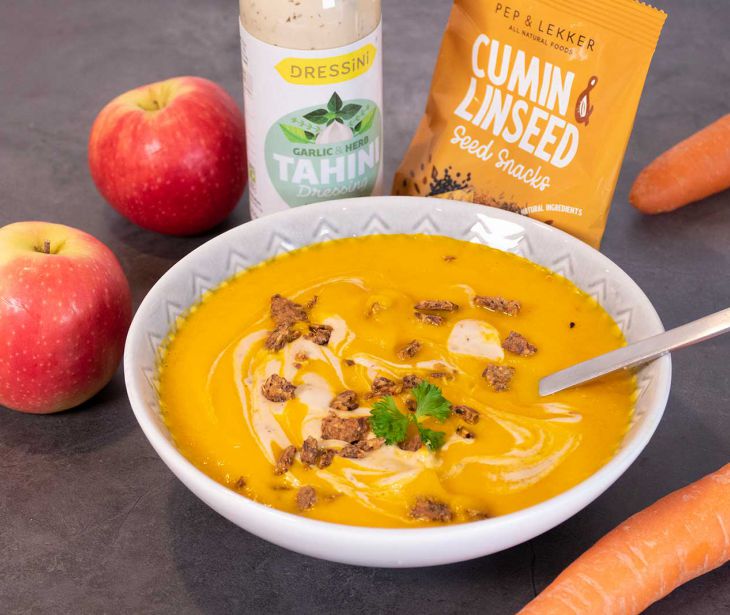 Carrot apple and turmeric soup with garlic & herb tahini dressing