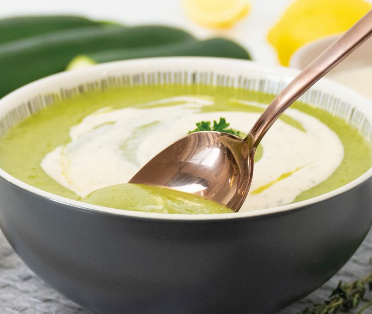 Warming courgette soup refined with herb and garlic dressings